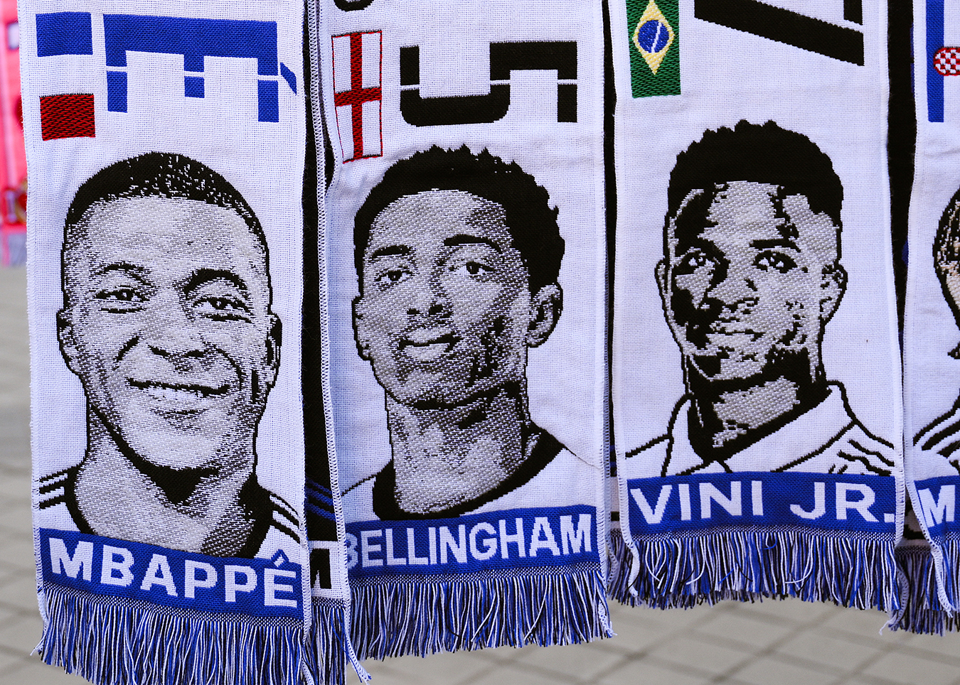 Scarves of Kylian Mbappe, Jude Bellingham, Vinicius Jr. 